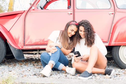 Two friends going on a roadtrip through countryside