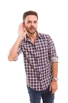 Young man trying to ear something - isolated over white