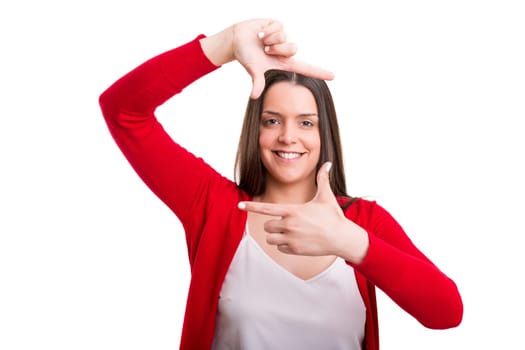 Young woman making framing key gesture - isolated over white