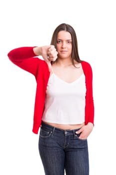 Studio shot of a young woman signaling thumbs down