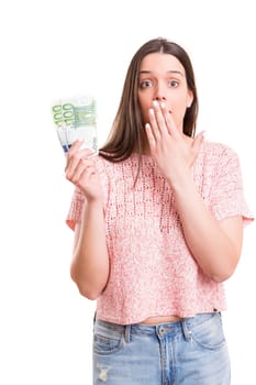 Beautiful young woman showing some banknotes