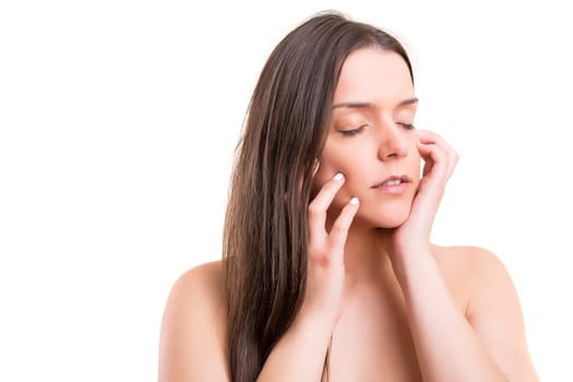 Beautiful woman with perfect skin posing over white
