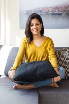 Beautiful woman relaxing in the living room