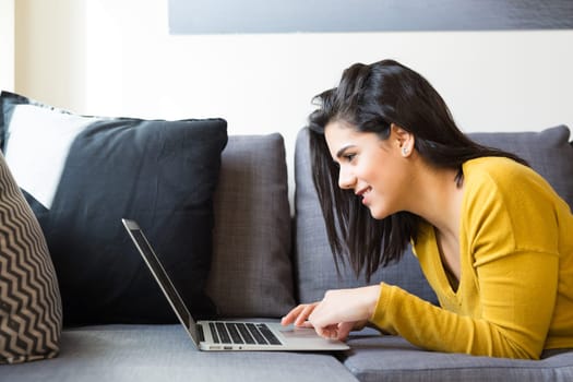Beautiful woman relaxing with a computer