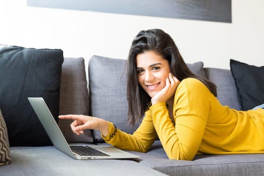 Beautiful woman relaxing with a computer