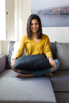 Beautiful woman relaxing in the living room