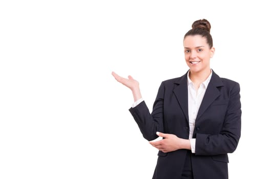 Young beautiful woman presenting your product, isolated over white background