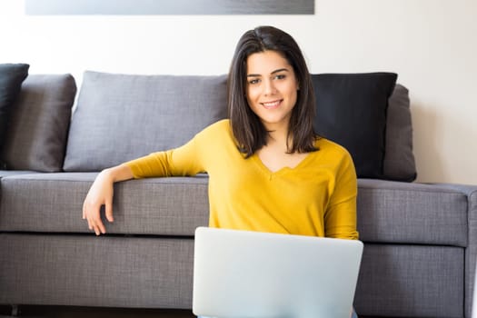 Beautiful woman relaxing with a computer