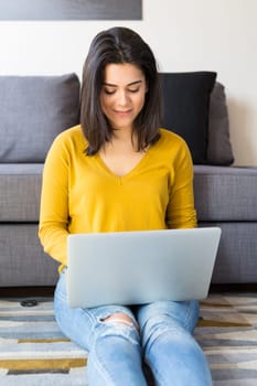 Beautiful woman relaxing with a computer