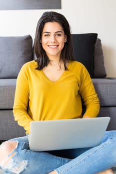 Beautiful woman relaxing with a computer