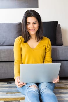 Beautiful woman relaxing with a computer