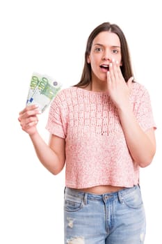 Beautiful young woman showing some banknotes