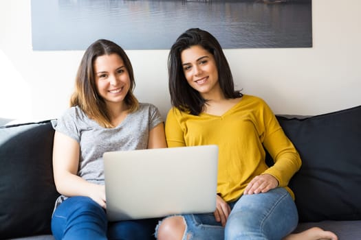 Beautiful young women at home studying for the final exams