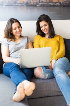 Beautiful young women at home studying for the final exams