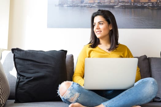 Beautiful woman relaxing with a computer