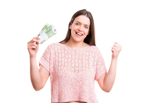 Beautiful young woman showing some banknotes