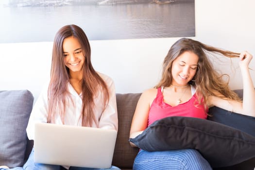 Beautiful young women at home studying for the final exams