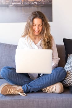 Beautiful woman relaxing with a computer