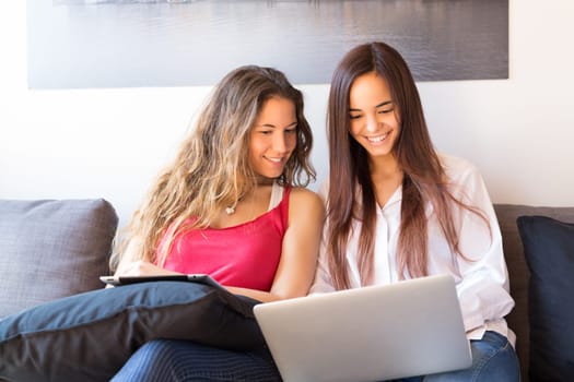 Beautiful young women at home studying for the final exams