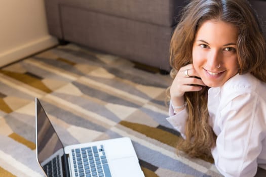 Beautiful woman relaxing with a computer