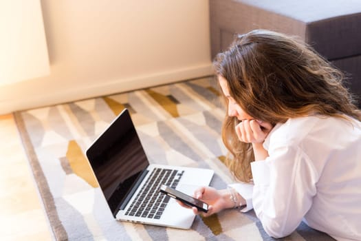 Beautiful woman relaxing with a computer