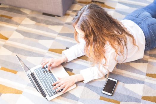 Beautiful woman relaxing with a computer