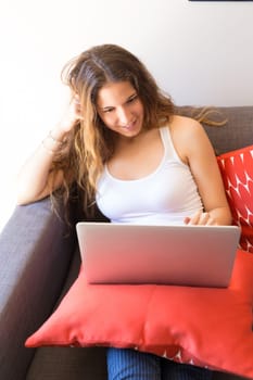 Beautiful woman relaxing with a computer