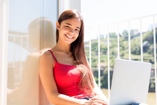 Beautiful woman relaxing with a computer