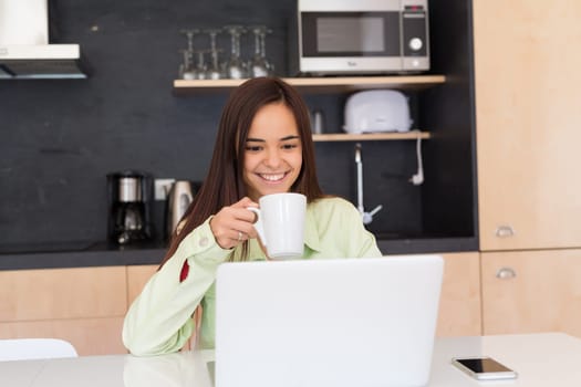 Young woman working at home in the morning