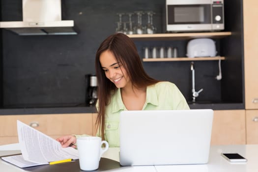 Young woman working at home in the morning