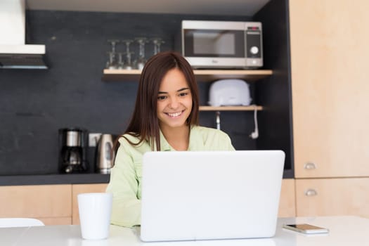 Young woman working at home in the morning