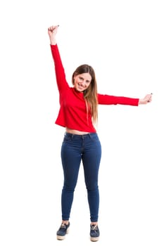 Studio shot: Happy woman with raised arms