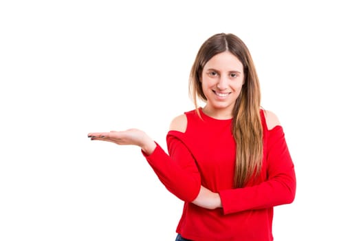 Young beautiful woman presenting your product, isolated over white background