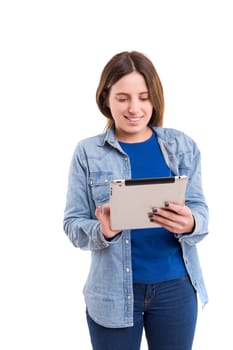 Beautiful woman relaxing with a tablet computer