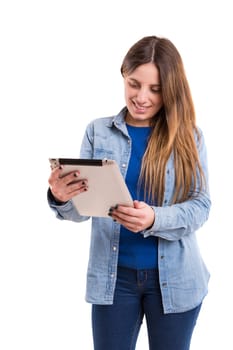 Beautiful woman relaxing with a tablet computer