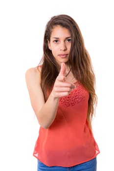 Young beautiful woman pointing at you, isolated over white