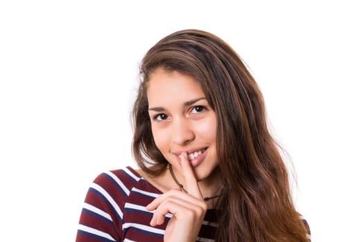 Beautiful young woman asking for silence isolated