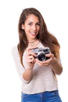 Beautiful woman holding a vintage camera, isolated over white background