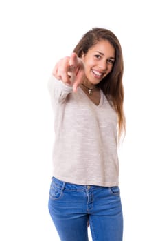 Young beautiful woman pointing at you, isolated over white