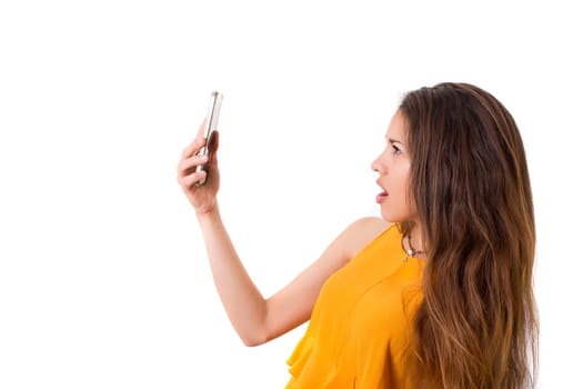 Young beautiful woman at the phone, isolated over a white background