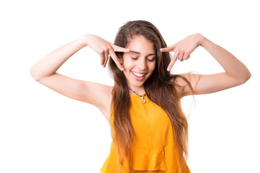 A beautiful young woman making a silly expression, isolated over white