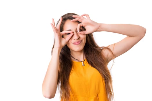 A beautiful young woman making a silly expression, isolated over white