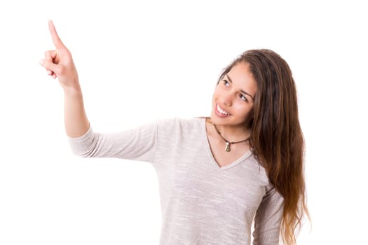 A beautiful woman pointing to something, isolated over a copy space background