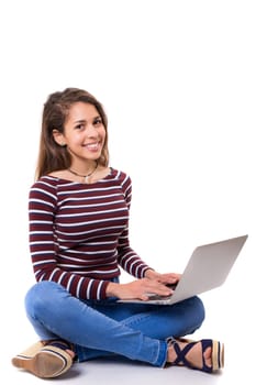 Young student working with her laptop, isolated over a white background