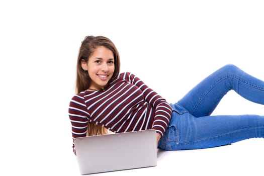 Young student working with her laptop, isolated over a white background