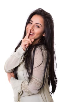 Beautiful young woman asking for silence isolated