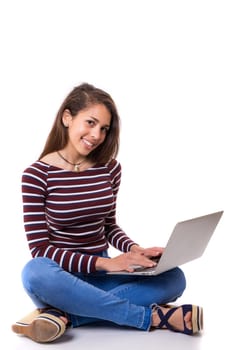 Young student working with her laptop, isolated over a white background