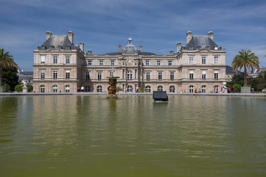 PARIS - AUGUST 13: Children's ships in fountain near Luxembourg Palace in the Luxembourg Garden on August 13, 2016 in Paris, France. Toy ships is most popular entertainment on Luxembourg Garden.