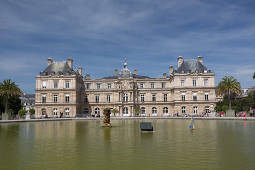 PARIS - AUGUST 13: Children's ships in fountain near Luxembourg Palace in the Luxembourg Garden on August 13, 2016 in Paris, France. Toy ships is most popular entertainment on Luxembourg Garden.