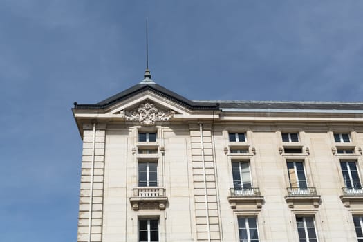 Facade of a traditional living building in Paris, France